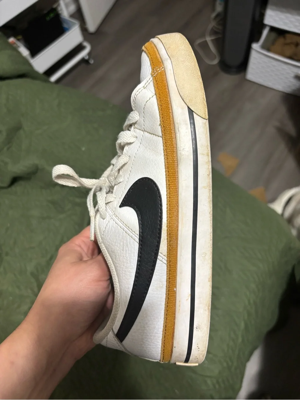 Nike White Leather Sneakers with Black Swoosh and Yellow Accent